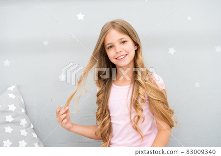 Good morning. Girl child long curly hair awake. Pleasant  83009340