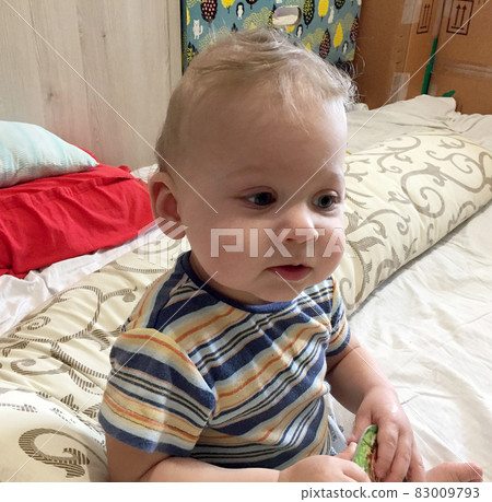 Beautiful baby boy with child face posing photographer Beautiful baby boy with child face posing photographer 83009793