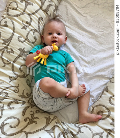 Beautiful baby boy with child face posing photographer Beautiful baby boy with child face posing photographer 83009794
