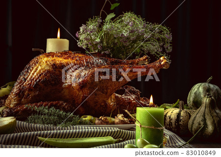 Greeting card design with roasted turkey, chicken and autumn traditional vegetables. Figs, pumpkins. Thanksgiving day Greeting card design with roasted turkey, chicken and autumn traditional vegetables. Figs, pumpkins. Thanksgiving day 83010849