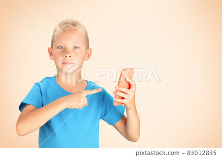 School boy holding smartphone School boy holding smartphone 83012835
