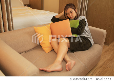 asian woman boring sit on the coach 83014563