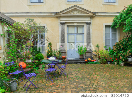 Front door decorated with autumn flowers, pumpkins Front door decorated with autumn flowers, pumpkins 83014750