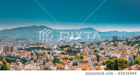 Urban panorama, aerial view, cityscape of Marseille, France. Sunny summer day with bright blue sky. Cityscape of Marseille, France. Urban background with sport Velodrome stadium. Stade Velodrome Urban panorama, aerial view, cityscape of Marseille, France. Sunny summer day with bright blue sky. Cityscape of Marseille, France. Urban background with sport Velodrome stadium. Stade Velodrome 83016944
