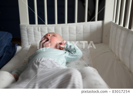 Yawning baby waking up at the morning. 83017254