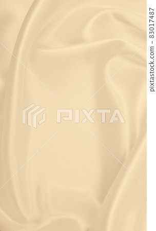 Smooth elegant golden silk or satin luxury cloth texture as wedding background. Luxurious background design. In Sepia toned. Retro style Smooth elegant golden silk or satin luxury cloth texture as wedding background. Luxurious background design. In Sepia toned. Retro style 83017487