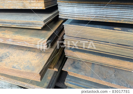 stacks of thick rusted flat metal sheets - close-up stacks of thick rusted flat metal sheets - close-up 83017781