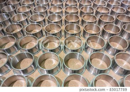 full frame batch array of shiny steel cylindrical sleeve parts with flange full frame batch array of shiny steel cylindrical sleeve parts with flange 83017789