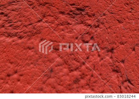 red plaster with decorative indentation finish wall texture and background red plaster with decorative indentation finish wall texture and background 83018244