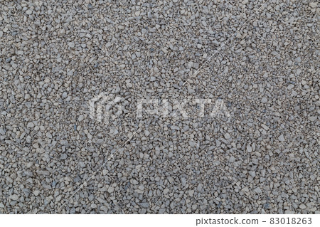 Dry white limestone ballast flat full frame background. Small gray dusty broken macadam stones texture. Dry white limestone ballast flat full frame background. Small gray dusty broken macadam stones texture. 83018263
