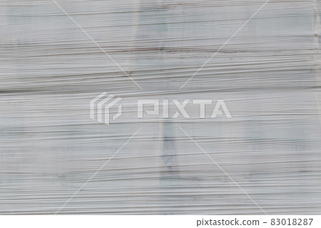 white shrink wrap film with horizontal folds - full frame background and flat texture white shrink wrap film with horizontal folds - full frame background and flat texture 83018287