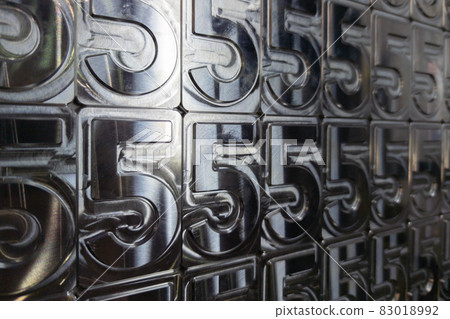 shiny metal machined digit 5 plates tiled tightly - full frame background 83018992