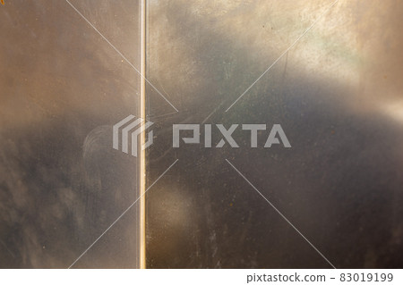 Uncoated flat cold rolled steel sheet surface with with one bent rib. Close-up with selective focus. Uncoated flat cold rolled steel sheet surface with with one bent rib. Close-up with selective focus. 83019199