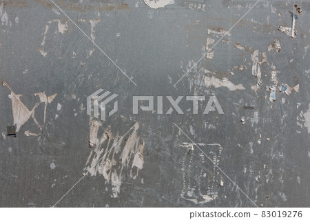 zinc-plated sheet fence with paper advertisements leftovers 83019276