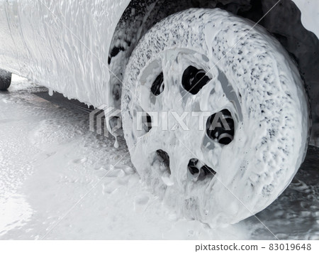 close-up view of car at carwash covered with soap sud close-up view of car at carwash covered with soap sud 83019648