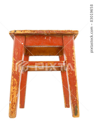 Old wooden stool with brown peeling paint. Loft style chair isolated on a white background. Old wooden stool with brown peeling paint. Loft style chair isolated on a white background. 83019658