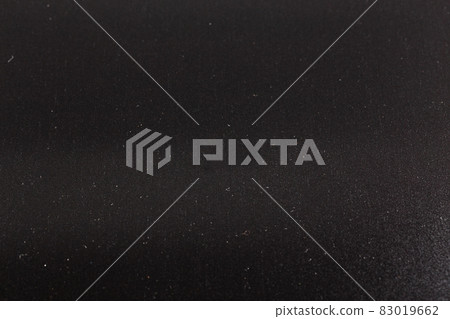 close-up empty black background covered with small dust particles with selective focus close-up empty black background covered with small dust particles with selective focus 83019662