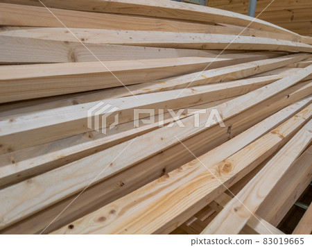 pile of long square section wooden sticks, slightly bent pile of long square section wooden sticks, slightly bent 83019665