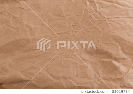 Ragged crumpled brown kraft paper texture and full frame background Ragged crumpled brown kraft paper texture and full frame background 83019784