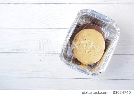 close up of sweet cookies in take away box on wooden table close up of sweet cookies in take away box on wooden table 83024740