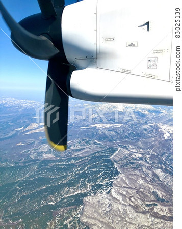 ANA propeller plane facing the direction of Aomori from the sky above Takada, Aomori City ANA propeller plane facing the direction of Aomori from the sky above Takada, Aomori City 83025139