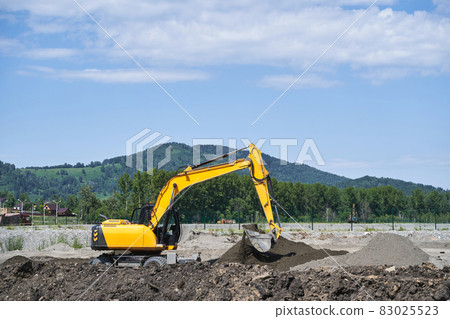 Demolition constuction. Excavator machine build road at mountain 83025523
