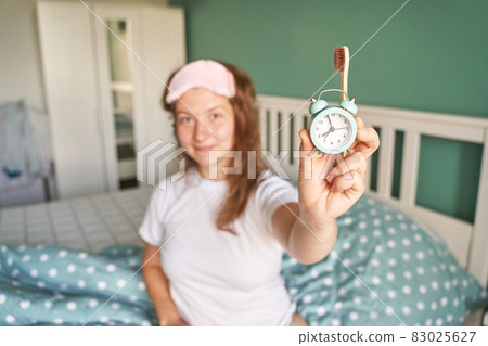 Morning routine. Young pretty woman wake up at home. Bed time. Snooze alarm Morning routine. Young pretty woman wake up at home. Bed time. Snooze alarm 83025627