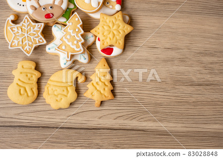 Merry Christmas with homemade cookies on wood table background. Xmas, party, holiday and happy New Year concept 83028848