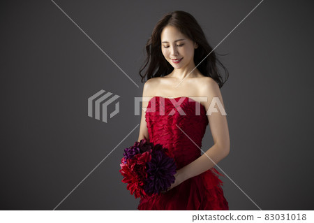 Woman in a red dress Woman in a red dress 83031018