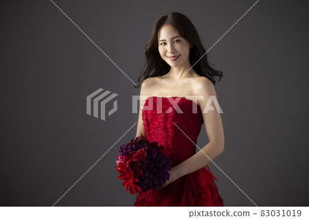 Woman in a red dress Woman in a red dress 83031019