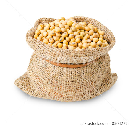 Dried soya beans in bag sack isolated on white background. Dried soya beans in bag sack isolated on white background. 83032791