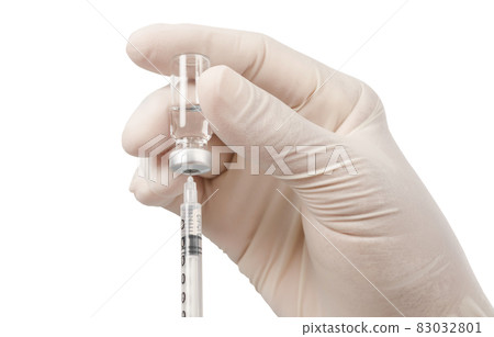 Syringe, medical injection vaccination in hand with glove isolated on white background. 83032801