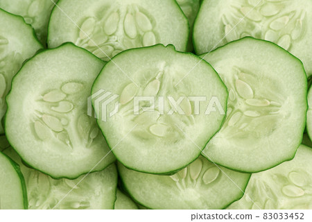 Fresh slice cucumber close-up background. Fresh slice cucumber close-up background. 83033452