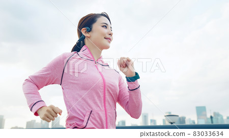 Woman jogging Woman jogging 83033634