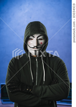 hacker with anonymous mask. High quality and resolution beautiful photo concept hacker with anonymous mask. High quality and resolution beautiful photo concept 83034919