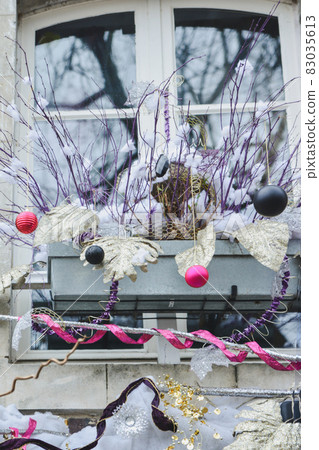 Christmas decorations on the window in France Christmas decorations on the window in France 83035613