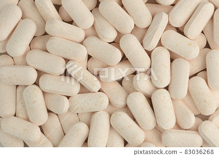 Pills close-up background. Macro shot. Medicine pattern. Pills close-up background. Macro shot. Medicine pattern. 83036268