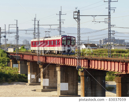 Kintetsu Myoji Line train crossing the Yamato River Kintetsu Myoji Line train crossing the Yamato River 83037039
