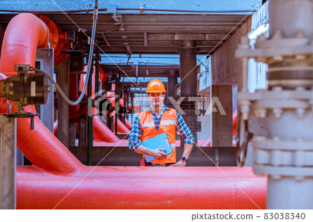 Industry engineer under checking the industry cooling tower air conditioner is water cooling tower air chiller HVAC of large industrial building to control air system. 83038340