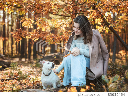Beautiful Young Girl With Her Dog In The Forest 83039464