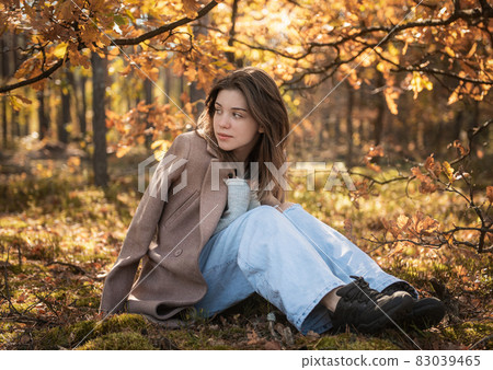 Young teenager girl in the autumn forest 83039465