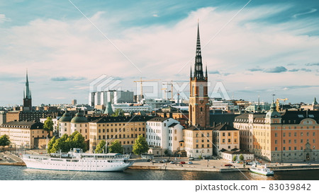Stockholm, Sweden. Gamla Stan Is Famous Popular Place And Destination Scenic. Riddarholm Church In Sunny Summer Cityscape Skyline. Scenic View Of Embankment In Old Town. UNESCO World Heritage Site. 83039842