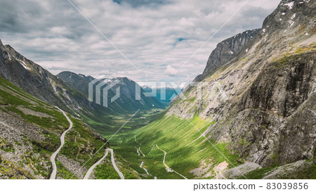 Trollstigen, Andalsnes, Norway. Cars Goes On Serpentine Mountain Road Trollstigen. Famous Norwegian Landmark And Popular Destination. Norwegian County Road 63 In Summer Day. 4K 83039856