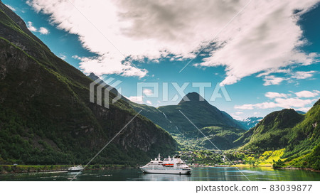Geirangerfjord, Norway. Touristic Ship Ferry Boat Cruise Ship Liner Floating Near Geiranger In Geirangerfjorden In Summer Day. Famous Norwegian Landmark And Popular Destination. 4K 83039877
