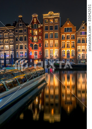 Night Amsterdam Houses on Water and Pleasure Boat Night Amsterdam Houses on Water and Pleasure Boat 83042031