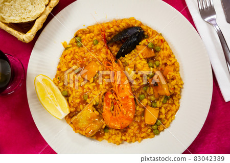 Spainsh dish seafood paella with rice, shrimps and mussels 83042389