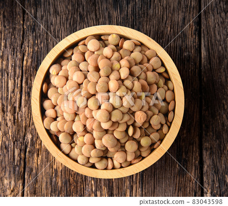lentils in wood bowl 83043598