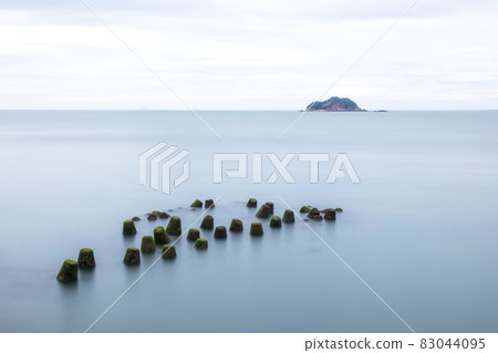 Small rocks on the foggy sea Small rocks on the foggy sea 83044095