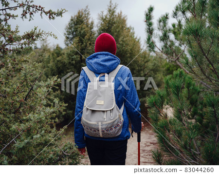 Portrait of woman hiker standing on the slope of mountain 83044260