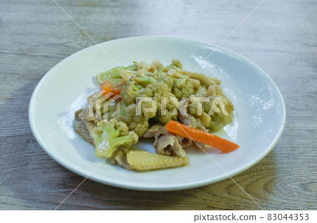 spicy stir fried cauliflower with carrot and pork on plate spicy stir fried cauliflower with carrot and pork on plate 83044353
